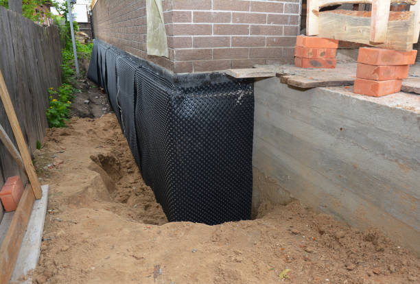 SJ Waterproofing Pros technician performing targeted Emergency Waterproofing assessment in Commack, NY
